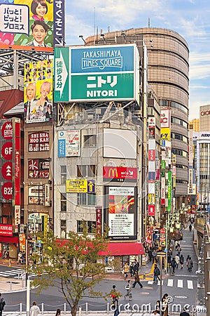 Corner of Shinjuku Rambling Road and KÅshÅ« KaidÅ route full of catchy advertising signs. Editorial Stock Photo